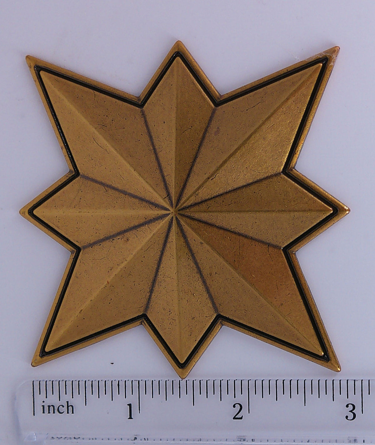 Captain Marvel metal prop emblem